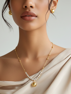 Close-up of a rhinestone ball pendant necklace with anti-tarnish finish.