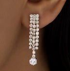 Close-up of rhinestone dangle earrings from the triple-layer necklace set.