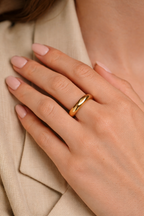 Gold organic wave ring with smooth sculpted band and modern minimalist design
