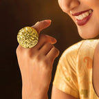 Woman wearing Anti-tarnish gold coin-style ring with an adjustable band and intricate design.