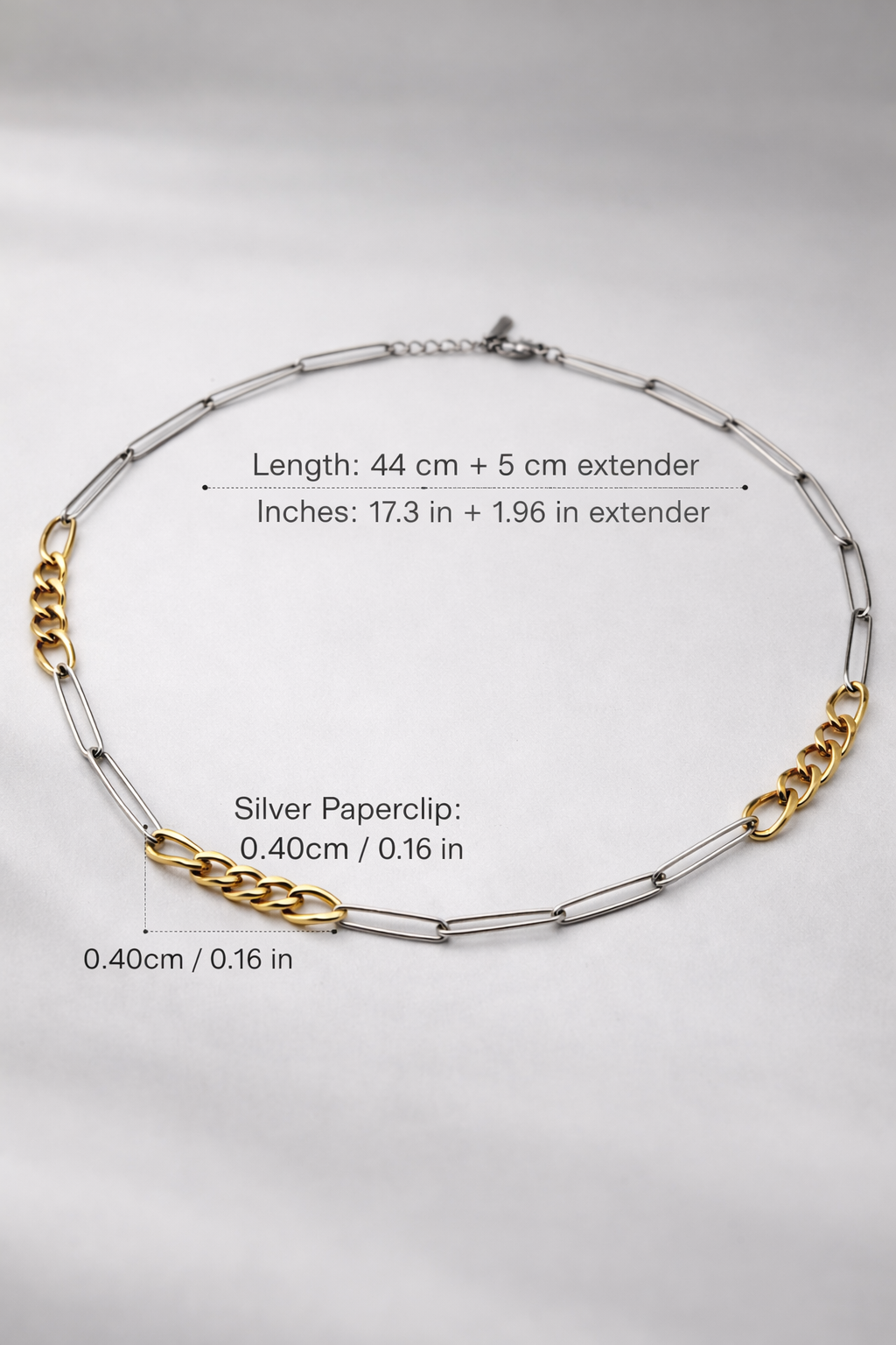 Necklace with chain details on a gray background
