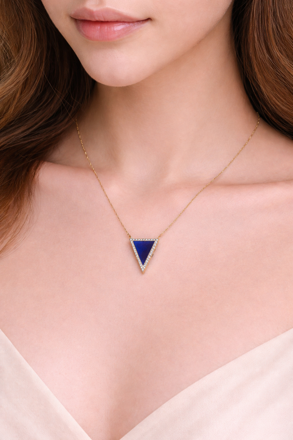 Necklace with a lapis  lazuli triangle pendant worn by a woman